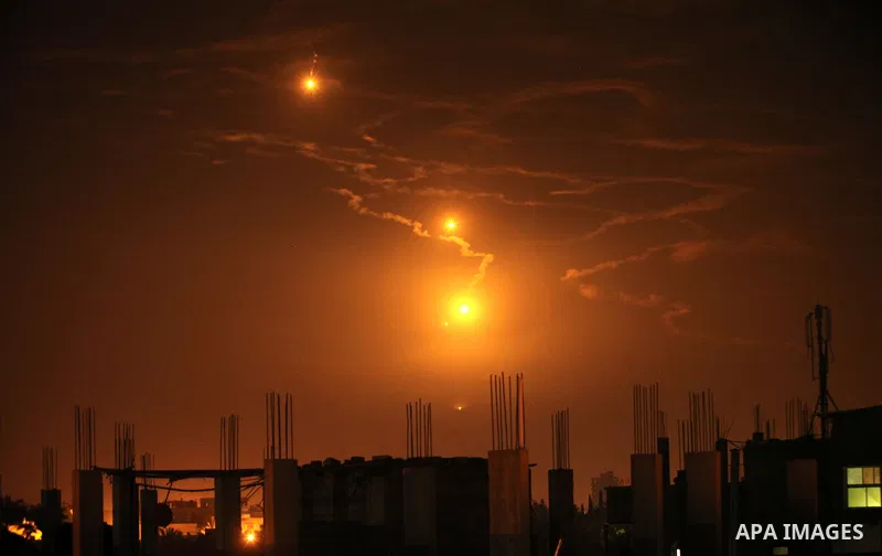 Flares fired by Israeli forces to check the border are seen over Gaza City on February 6, 2017. Israel struck a number of Hamas positions in Gaza after a "projectile" fired from the Palestinian enclave crashed in a borde...