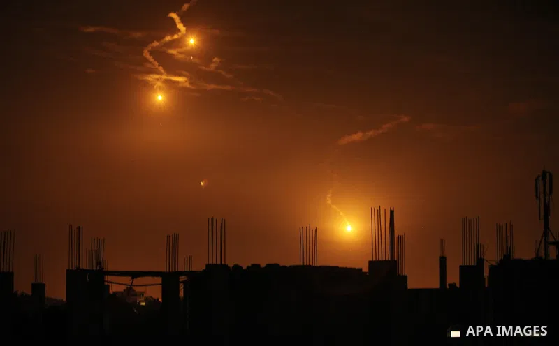Flares fired by Israeli forces to check the border are seen over Gaza City on February 6, 2017. Israel struck a number of Hamas positions in Gaza after a "projectile" fired from the Palestinian enclave crashed in a borde...