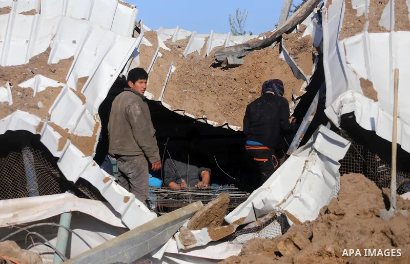 Palestinians inspect the damage to a chicken farm in Gaza City's eastern suburb of Shujaiya on February 7, 2017, following a series of strikes carried out the day before by Israeli forces against the Hamas movement in th...