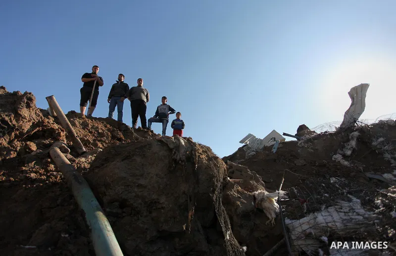 Palestinians inspect the damage to a chicken farm in Gaza City's eastern suburb of Shujaiya on February 7, 2017, following a series of strikes carried out the day before by Israeli forces against the Hamas movement in th...