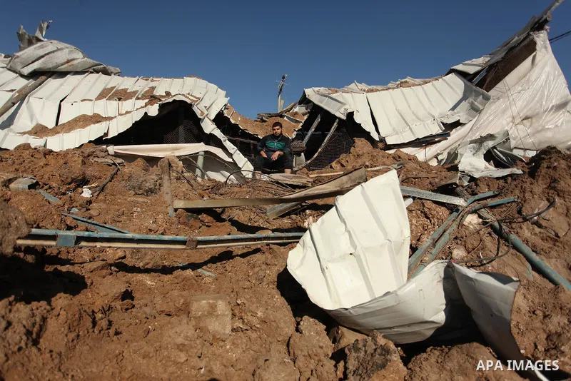 Palestinians inspect the damage to a chicken farm in Gaza City's eastern suburb of Shujaiya on February 7, 2017, following a series of strikes carried out the day before by Israeli forces against the Hamas movement in th...