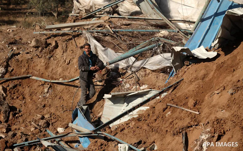 Palestinians inspect the damage to a chicken farm in Gaza City's eastern suburb of Shujaiya on February 7, 2017, following a series of strikes carried out the day before by Israeli forces against the Hamas movement in th...