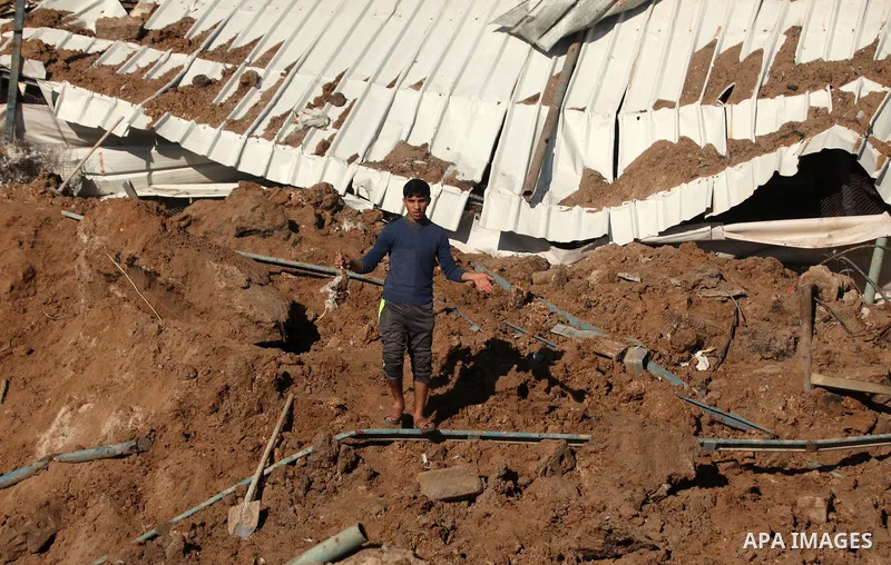 Palestinians inspect the damage to a chicken farm in Gaza City's eastern suburb of Shujaiya on February 7, 2017, following a series of strikes carried out the day before by Israeli forces against the Hamas movement in th...