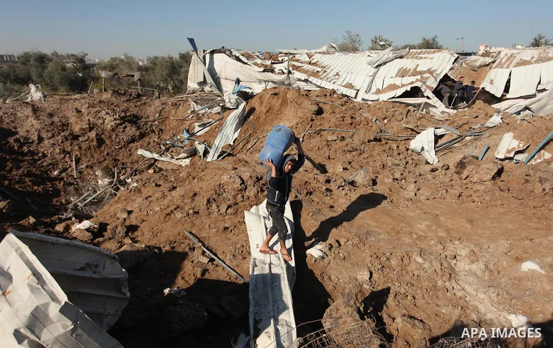 Palestinians inspect the damage to a chicken farm in Gaza City's eastern suburb of Shujaiya on February 7, 2017, following a series of strikes carried out the day before by Israeli forces against the Hamas movement in th...
