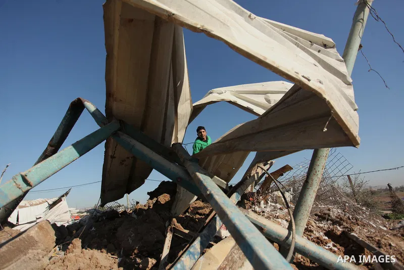 Palestinians inspect the damage to a chicken farm in Gaza City's eastern suburb of Shujaiya on February 7, 2017, following a series of strikes carried out the day before by Israeli forces against the Hamas movement in th...