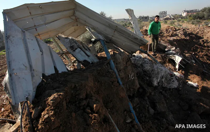 Palestinians inspect the damage to a chicken farm in Gaza City's eastern suburb of Shujaiya on February 7, 2017, following a series of strikes carried out the day before by Israeli forces against the Hamas movement in th...