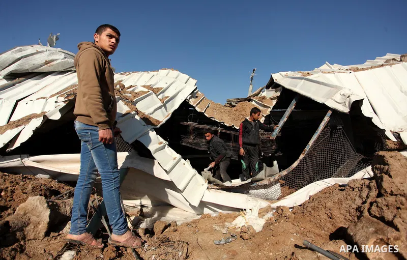 Palestinians inspect the damage to a chicken farm in Gaza City's eastern suburb of Shujaiya on February 7, 2017, following a series of strikes carried out the day before by Israeli forces against the Hamas movement in th...