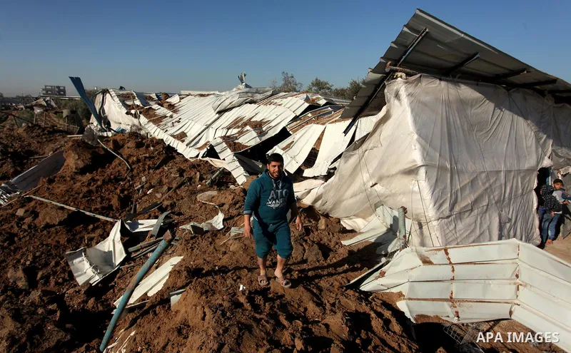 Palestinians inspect the damage to a chicken farm in Gaza City's eastern suburb of Shujaiya on February 7, 2017, following a series of strikes carried out the day before by Israeli forces against the Hamas movement in th...