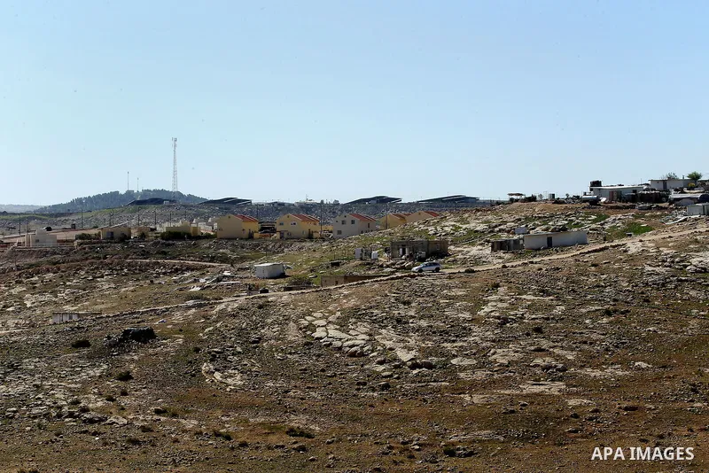 A picture taken from the West Bank city of Hebron on February 7, 2017 shows a view of the Kiryat Arba Jewish settlement on the outskirts of the Palestinian city. Israel’s parliament passed a contentious law late Monday t...