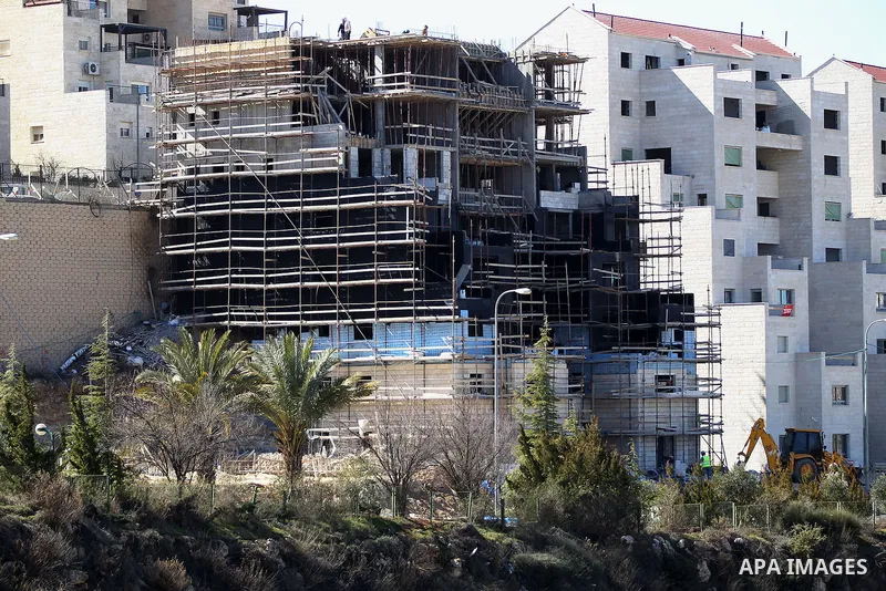 A picture taken from the West Bank city of Hebron on February 7, 2017 shows a view of the Kiryat Arba Jewish settlement on the outskirts of the Palestinian city. Israel’s parliament passed a contentious law late Monday t...