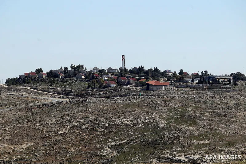 A picture taken from the West Bank city of Hebron on February 7, 2017 shows a view of the Kiryat Arba Jewish settlement on the outskirts of the Palestinian city. Israel’s parliament passed a contentious law late Monday t...