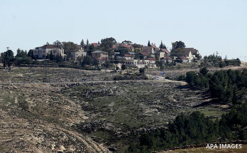 A picture taken from the West Bank city of Hebron on February 7, 2017 shows a view of the Kiryat Arba Jewish settlement on the outskirts of the Palestinian city. Israel’s parliament passed a contentious law late Monday t...