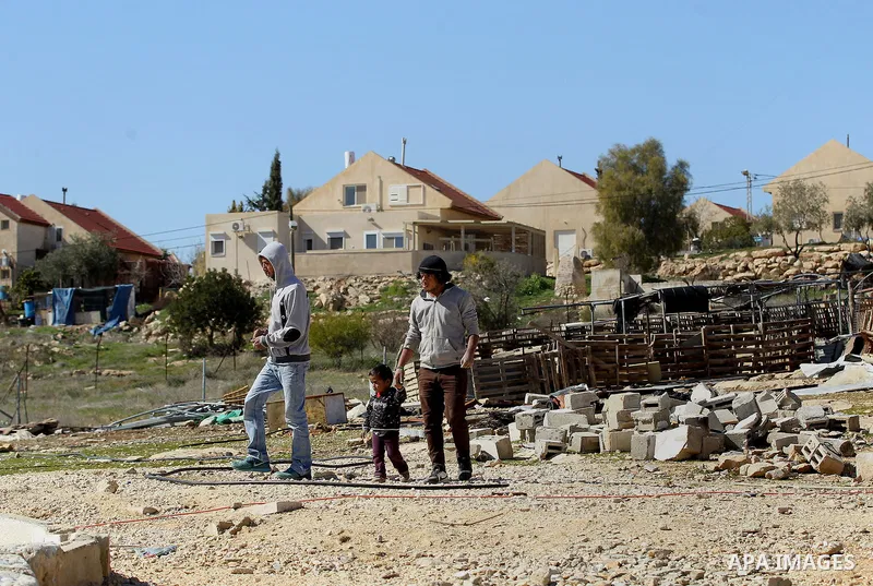 A picture taken from the West Bank city of Hebron on February 7, 2017 shows a view of the Kiryat Arba Jewish settlement on the outskirts of the Palestinian city. Israel’s parliament passed a contentious law late Monday t...