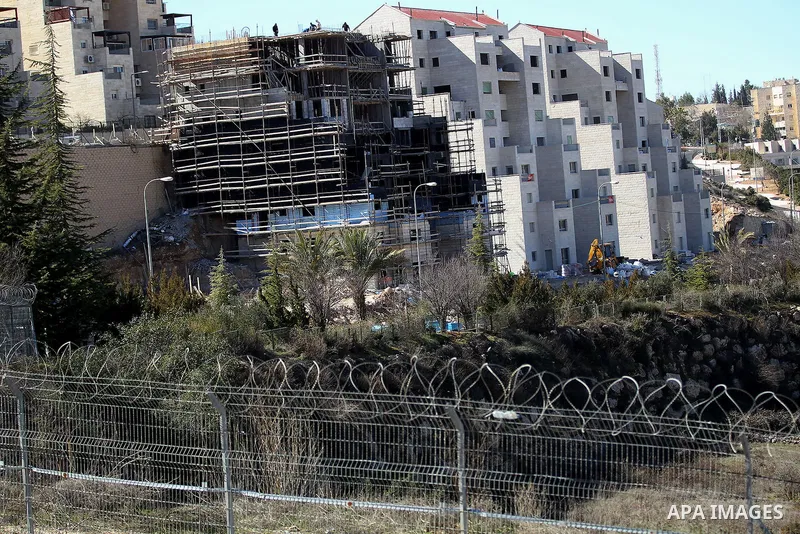 A picture taken from the West Bank city of Hebron on February 7, 2017 shows a view of the Kiryat Arba Jewish settlement on the outskirts of the Palestinian city. Israel’s parliament passed a contentious law late Monday t...
