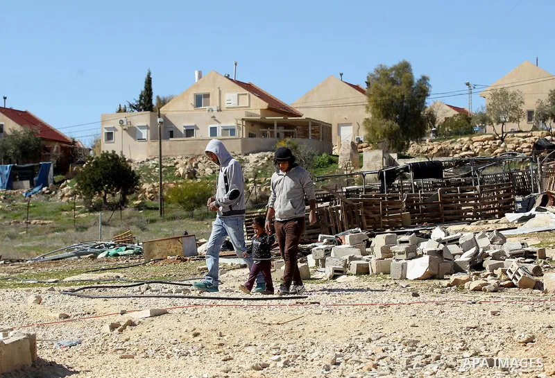 A picture taken from the West Bank city of Hebron on February 7, 2017 shows a view of the Kiryat Arba Jewish settlement on the outskirts of the Palestinian city. Israel’s parliament passed a contentious law late Monday t...