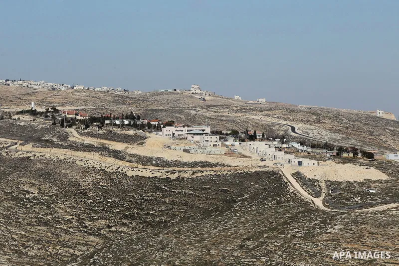 A picture taken from the West Bank city of Hebron on February 7, 2017 shows a view of the Kiryat Arba Jewish settlement on the outskirts of the Palestinian city. Israel’s parliament passed a contentious law late Monday t...