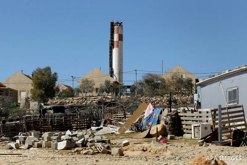 A picture taken from the West Bank city of Hebron on February 7, 2017 shows a view of the Kiryat Arba Jewish settlement on the outskirts of the Palestinian city. Israel’s parliament passed a contentious law late Monday t...