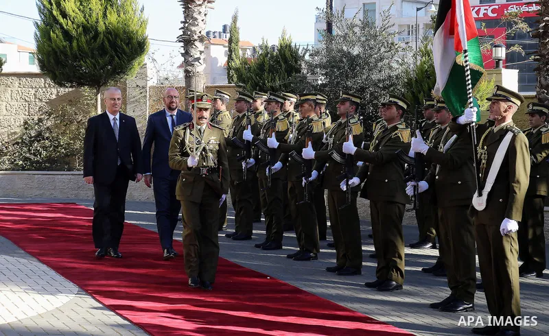 Palestinian Prime Minister Rami Hamdallah and Belgian Prime Minister Charles Michel review the honor guard in the West Bank city of Ramallah February 7, 2017. Photo by Prime Minister Office