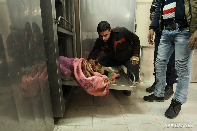 Relatives of the two Palestinians, who were killed in a bombing of a tunnel near the Egyptian border, mourn over their body at a morgue in hospital in Rafah in the southern Gaza Strip February 9, 2017. Photo by Ashraf Am...