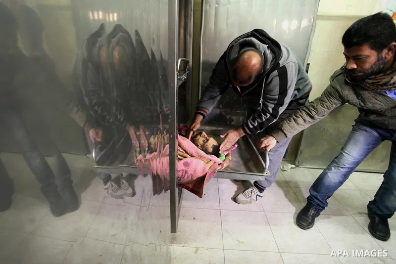 A Relative of one of the two Palestinians, who were killed in a bombing of a tunnel near the Egyptian border, mourn over his body at a morgue in hospital in Rafah in the southern Gaza Strip February 9, 2017. Photo by Ash...