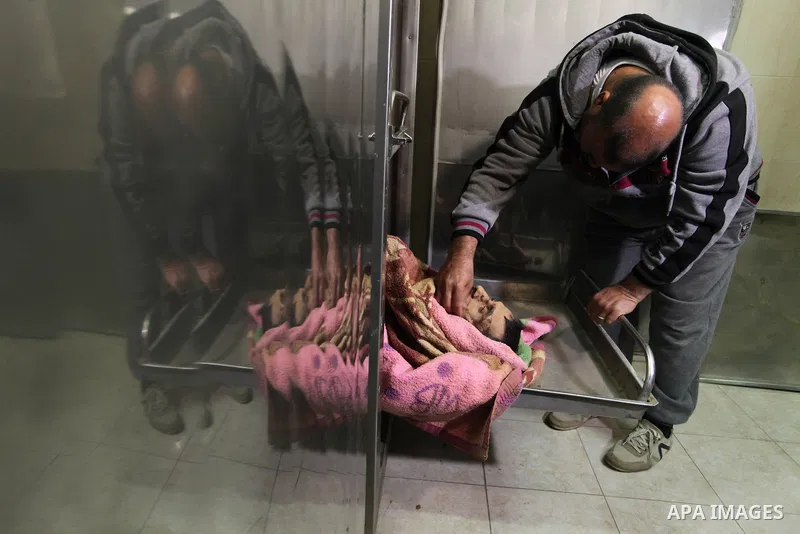 A Relative of one of the two Palestinians, who were killed in a bombing of a tunnel near the Egyptian border, mourn over his body at a morgue in hospital in Rafah in the southern Gaza Strip February 9, 2017. Photo by Ash...