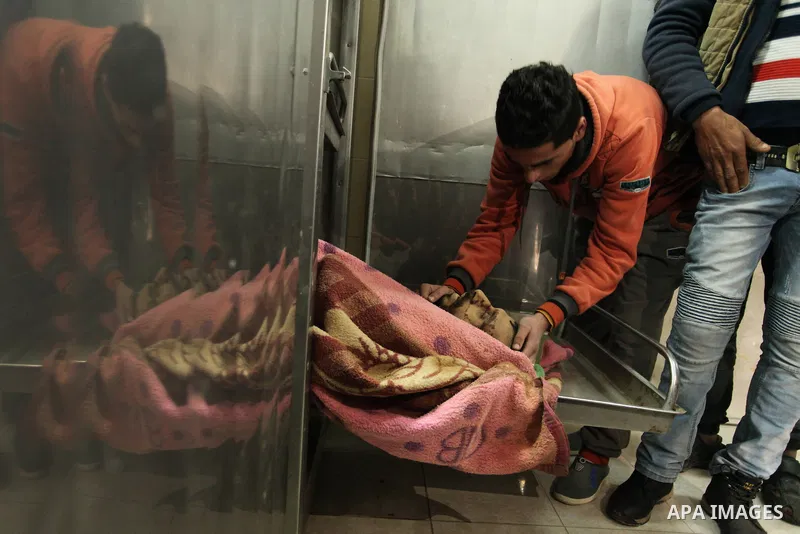 A Relative of one of the two Palestinians, who were killed in a bombing of a tunnel near the Egyptian border, mourn over his body at a morgue in hospital in Rafah in the southern Gaza Strip February 9, 2017. Photo by Ash...
