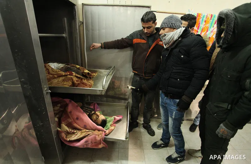 Relatives of the two Palestinians, who were killed in a bombing of a tunnel near the Egyptian border, mourn over their body at a morgue in hospital in Rafah in the southern Gaza Strip February 9, 2017. Photo by Ashraf Am...