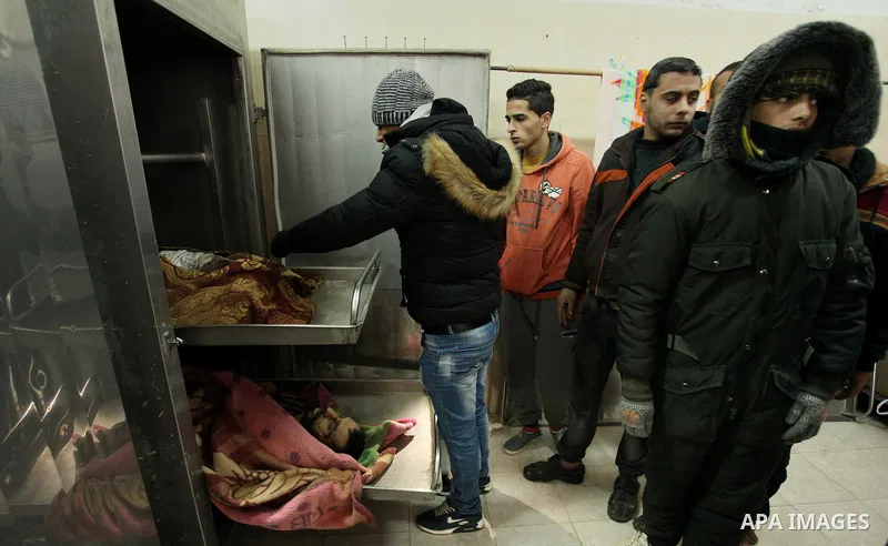 Relatives of the two Palestinians, who were killed in a bombing of a tunnel near the Egyptian border, mourn over their body at a morgue in hospital in Rafah in the southern Gaza Strip February 9, 2017. Photo by Ashraf Am...
