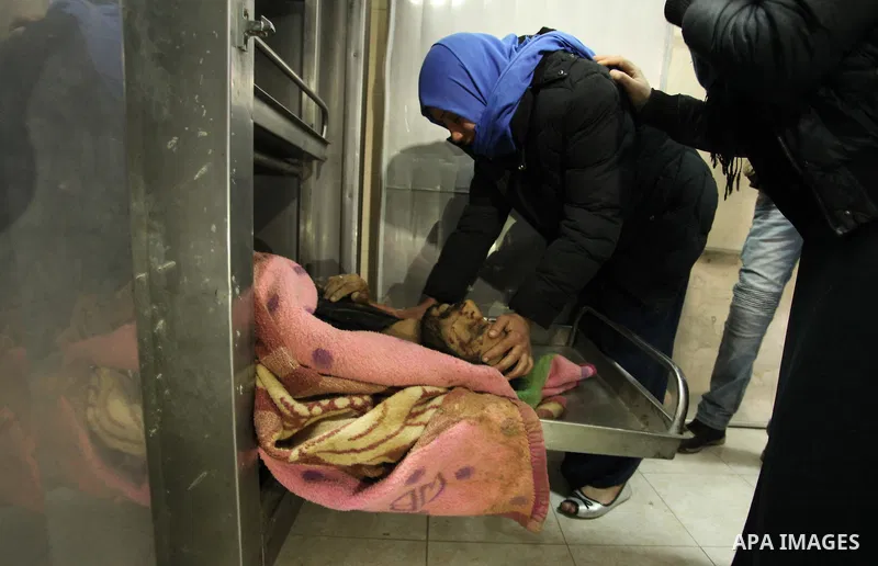 A Relative of one of the two Palestinians, who were killed in a bombing of a tunnel near the Egyptian border, mourn over his body at a morgue in hospital in Rafah in the southern Gaza Strip February 9, 2017. Photo by Ash...