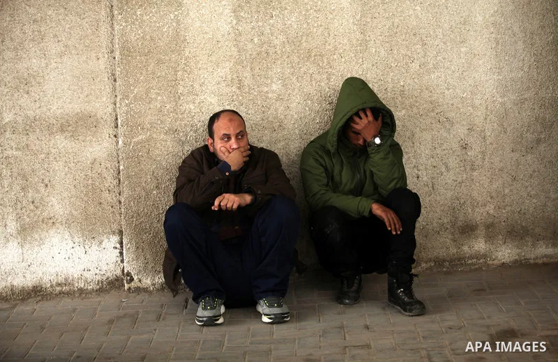 Relatives of one of the two Palestinians, who were killed in a bombing of a tunnel near the Egyptian border, mourn at a hospital in Rafah in the southern Gaza Strip February 9, 2017. Photo by Ashraf Amra
