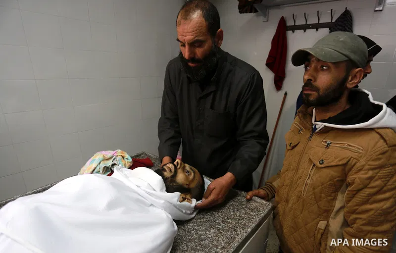 Relatives morn on the body of Palestinian Mohammed al-Aqraa, who was killed in a tunnel explosion near the Egyptian border, during his funeral in Gaza City February 9, 2017. Photo by Mohammed Asad