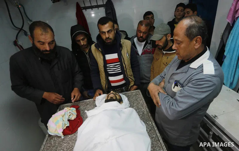 Relatives morn on the body of Palestinian Mohammed al-Aqraa, who was killed in a tunnel explosion near the Egyptian border, during his funeral in Gaza City February 9, 2017. Photo by Mohammed Asad