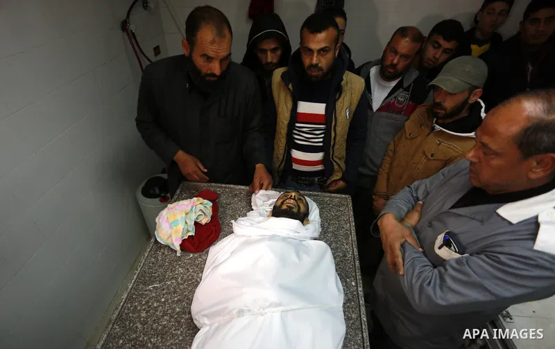 Relatives morn on the body of Palestinian Mohammed al-Aqraa, who was killed in a tunnel explosion near the Egyptian border, during his funeral in Gaza City February 9, 2017. Photo by Mohammed Asad
