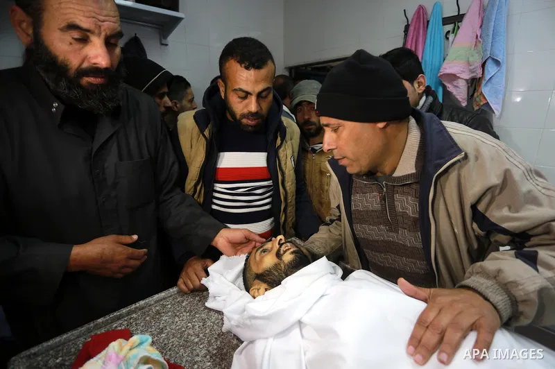 Relatives morn on the body of Palestinian Mohammed al-Aqraa, who was killed in a tunnel explosion near the Egyptian border, during his funeral in Gaza City February 9, 2017. Photo by Mohammed Asad