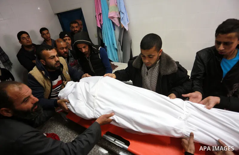 Relatives morn on the body of Palestinian Mohammed al-Aqraa, who was killed in a tunnel explosion near the Egyptian border, during his funeral in Gaza City February 9, 2017. Photo by Mohammed Asad