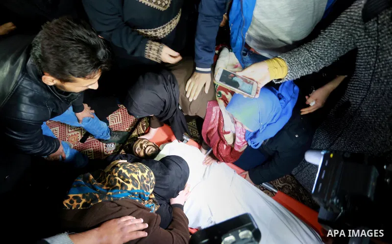Relatives morn on the body of Palestinian Mohammed al-Aqraa, who was killed in a tunnel explosion near the Egyptian border, during his funeral in Gaza City February 9, 2017. Photo by Mohammed Asad