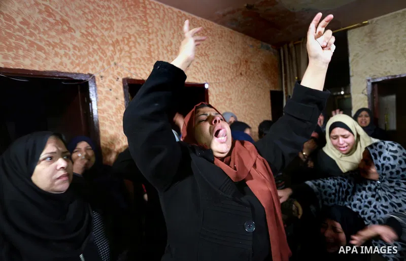 Relatives morn on the body of Palestinian Mohammed al-Aqraa, who was killed in a tunnel explosion near the Egyptian border, during his funeral in Gaza City February 9, 2017. Photo by Mohammed Asad