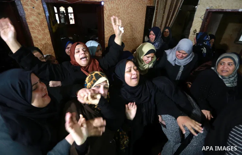 Relatives morn on the body of Palestinian Mohammed al-Aqraa, who was killed in a tunnel explosion near the Egyptian border, during his funeral in Gaza City February 9, 2017. Photo by Mohammed Asad