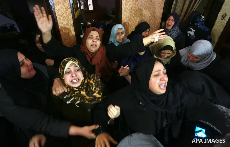 Relatives morn on the body of Palestinian Mohammed al-Aqraa, who was killed in a tunnel explosion near the Egyptian border, during his funeral in Gaza City February 9, 2017. Photo by Mohammed Asad