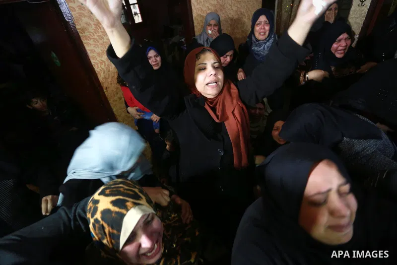 Relatives morn on the body of Palestinian Mohammed al-Aqraa, who was killed in a tunnel explosion near the Egyptian border, during his funeral in Gaza City February 9, 2017. Photo by Mohammed Asad