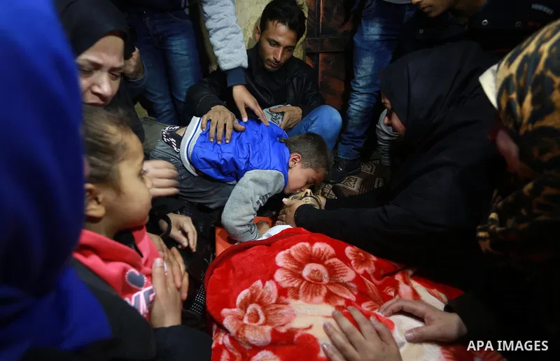 Relatives morn on the body of Palestinian Mohammed al-Aqraa, who was killed in a tunnel explosion near the Egyptian border, during his funeral in Gaza City February 9, 2017. Photo by Mohammed Asad