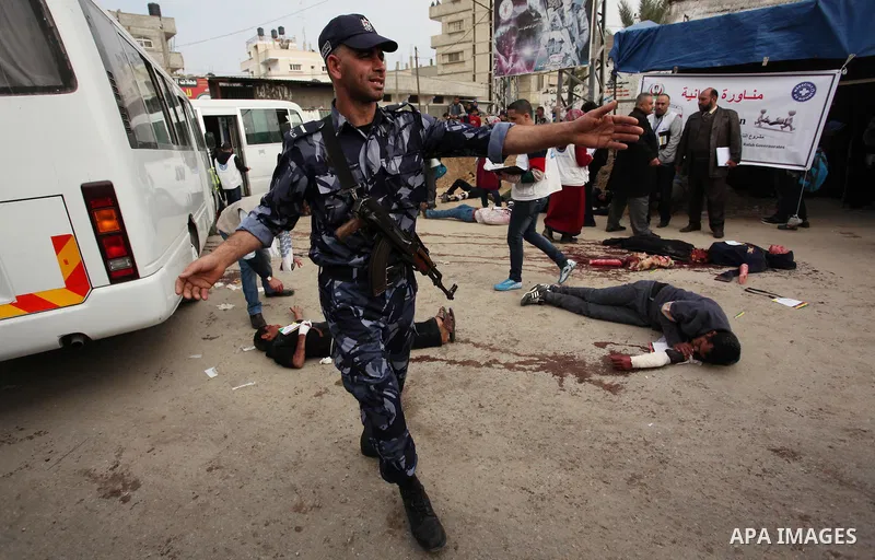 Palestinian rescue workers take part in an emergency simulation exercise, organized by the Palestinian Ministry of Health and Médecins du Monde France (Doctors of the World), in Rafah in the southern of Gaza Strip, on Fe...