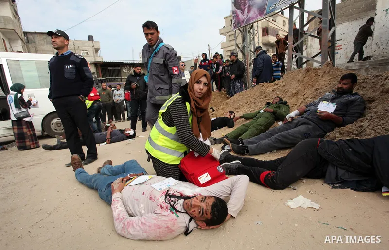 Palestinian rescue workers take part in an emergency simulation exercise, organized by the Palestinian Ministry of Health and Médecins du Monde France (Doctors of the World), in Rafah in the southern of Gaza Strip, on Fe...