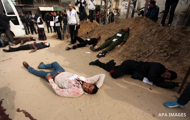 Palestinians take part in an emergency simulation exercise, organized by the Palestinian Ministry of Health and Médecins du Monde France (Doctors of the World), in Rafah in the southern of Gaza Strip, on February 9, 2017...