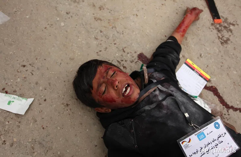 A Palestinian man takes part in an emergency simulation exercise, organized by the Palestinian Ministry of Health and Médecins du Monde France (Doctors of the World), in Rafah in the southern of Gaza Strip, on February 9...