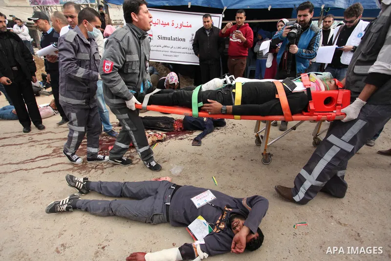Palestinian rescue workers take part in an emergency simulation exercise, organized by the Palestinian Ministry of Health and Médecins du Monde France (Doctors of the World), in Rafah in the southern of Gaza Strip, on Fe...