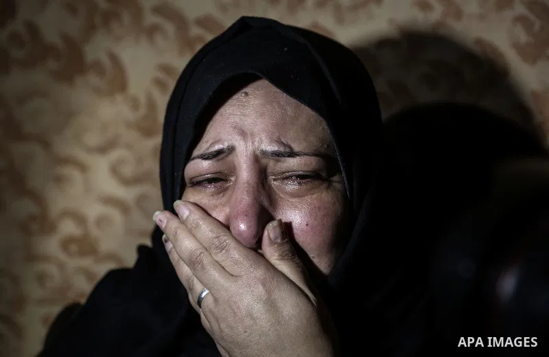 A relative morns on the body of Palestinian Mohammed al-Aqraa, who was killed in a tunnel explosion near the Egyptian border, during his funeral in Gaza City February 9, 2017. Photo by Mohammed Dahman
