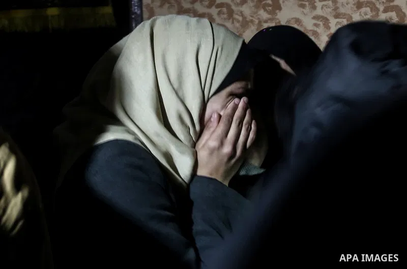 A relative morns on the body of Palestinian Mohammed al-Aqraa, who was killed in a tunnel explosion near the Egyptian border, during his funeral in Gaza City February 9, 2017. Photo by Mohammed Dahman