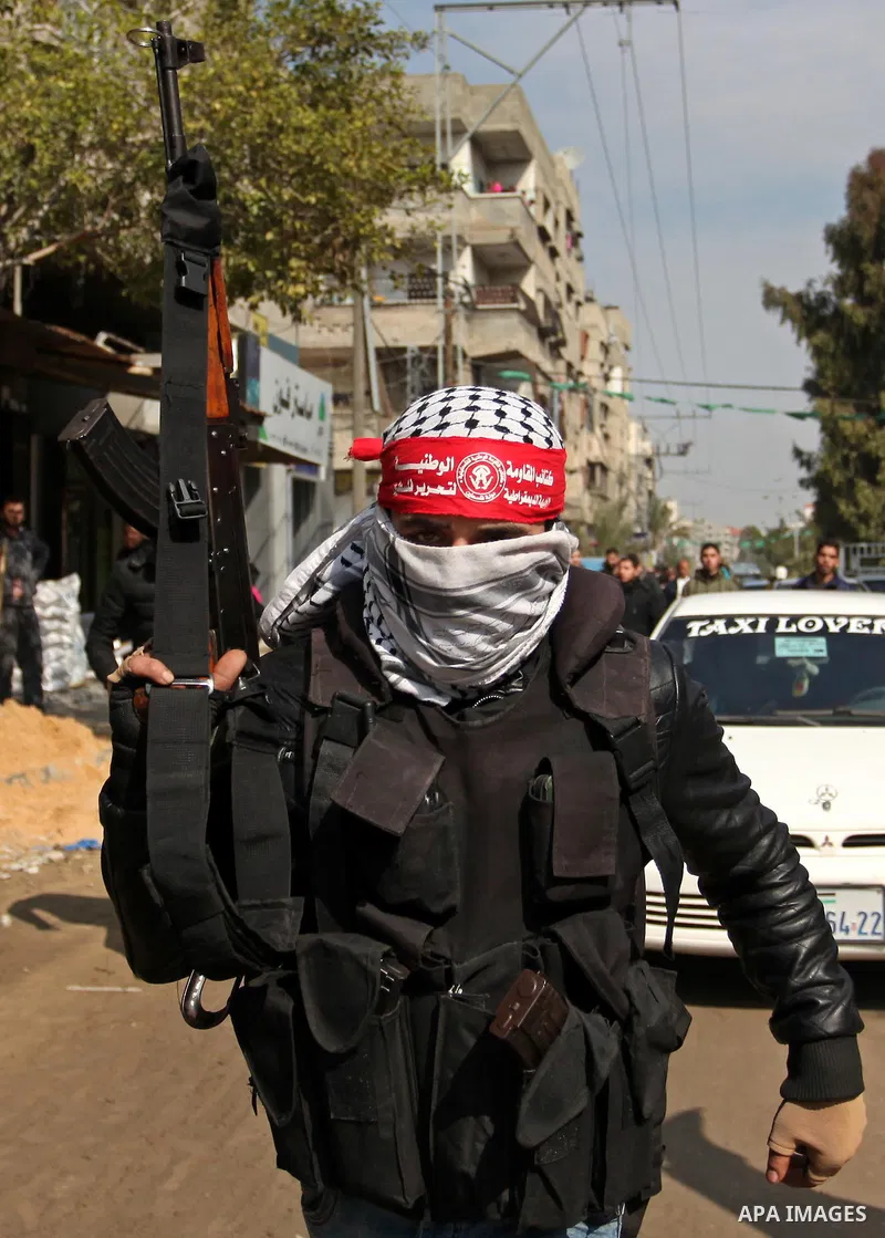 Palestinian militants attend the funeral of Palestinian Mohammed al-Aqraa, who was killed in a tunnel explosion near the Egyptian border, in Gaza City February 9, 2017. Photo by Ashraf Amra
