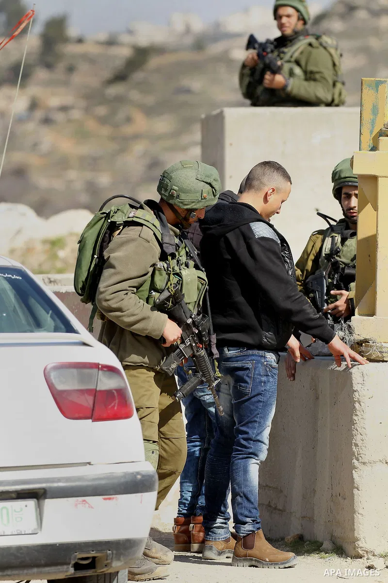 Israeli border policemen detain a Palestinian man during clashes following a demonstration against the construction of Jewish settlements in the occupied West Bank city of Hebron, on February 10, 2017. Photo by Wisam Has...